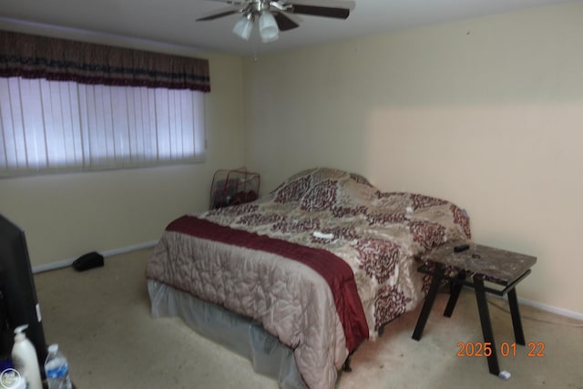 bedroom featuring light carpet and ceiling fan