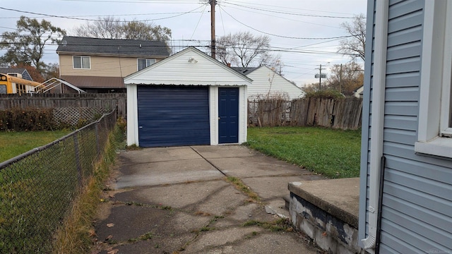 garage featuring a lawn