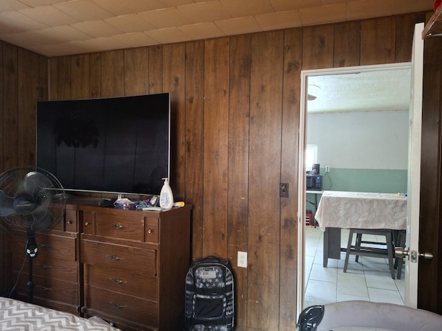 tiled bedroom with wooden walls