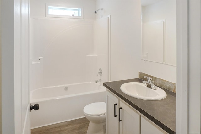 full bathroom with vanity, wood-type flooring, tub / shower combination, and toilet