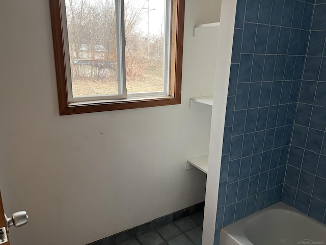 bathroom featuring  shower combination and tile patterned flooring