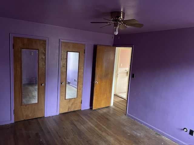 unfurnished bedroom with ceiling fan and wood-type flooring