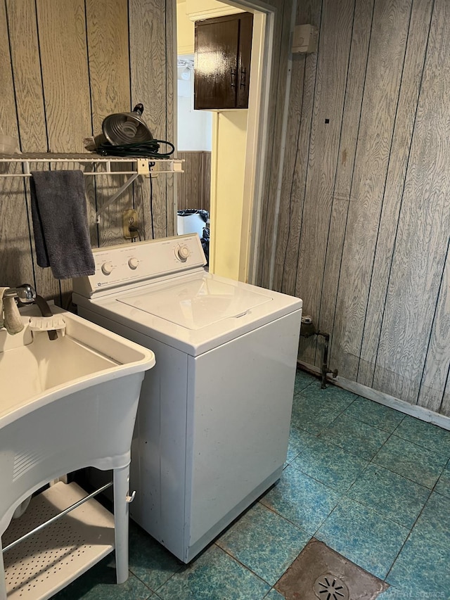 washroom with washer / clothes dryer and wood walls