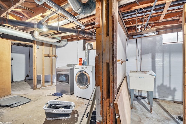 basement featuring sink and washing machine and dryer