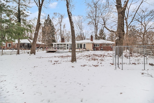 view of snow covered house