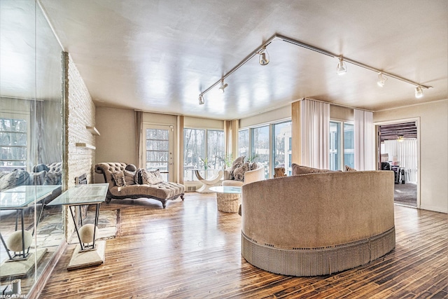 living room with hardwood / wood-style floors and a fireplace