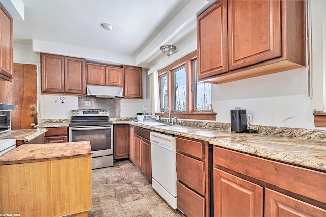 kitchen featuring sink, stainless steel range with electric cooktop, dishwasher, and light stone countertops