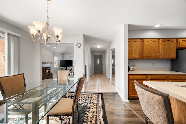 dining space featuring dark hardwood / wood-style flooring and a chandelier