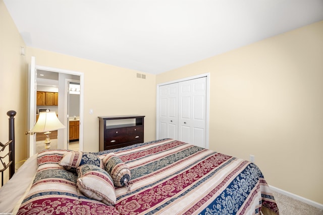 carpeted bedroom with a closet