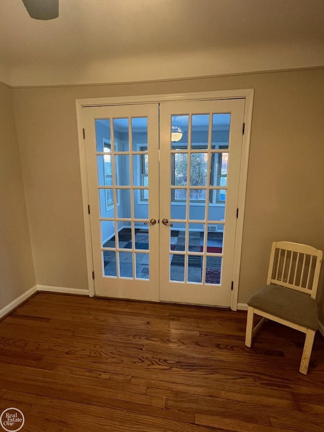 doorway with dark hardwood / wood-style flooring and french doors