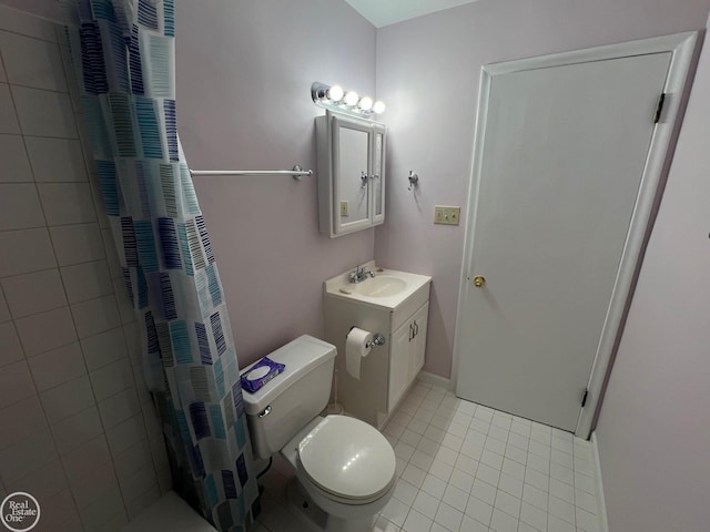 bathroom with a shower with curtain, vanity, toilet, and tile patterned flooring