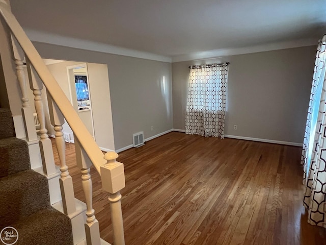 empty room with hardwood / wood-style floors