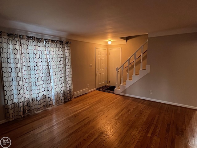 entryway with hardwood / wood-style flooring