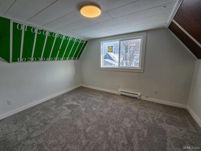 additional living space featuring a baseboard radiator, vaulted ceiling, and carpet