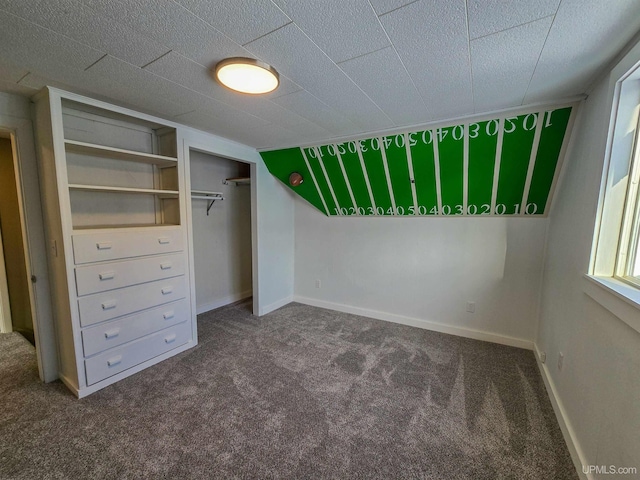 unfurnished bedroom with carpet floors and a closet