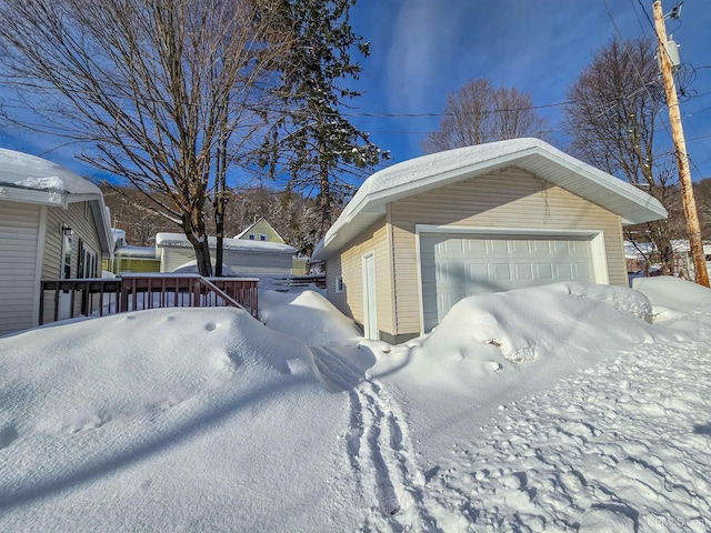 view of snow covered garage