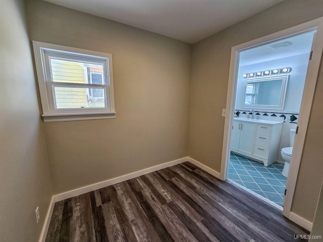 interior space with sink and dark hardwood / wood-style floors