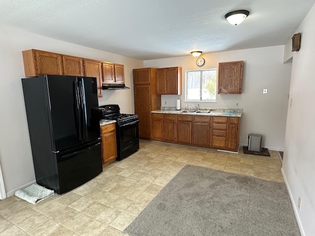 kitchen featuring sink and black appliances