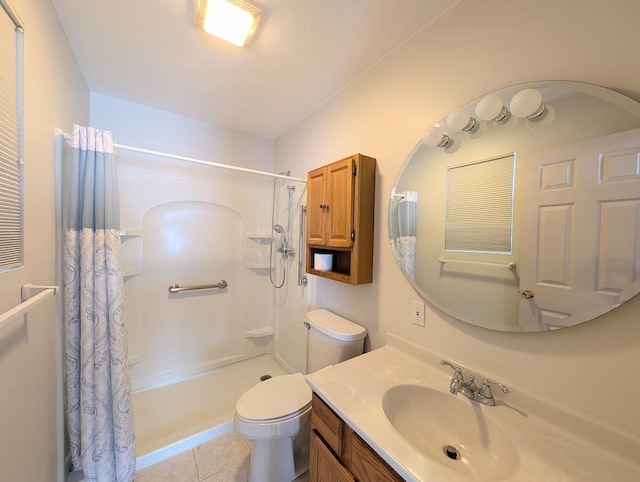 bathroom featuring a shower with curtain, vanity, toilet, and tile patterned flooring