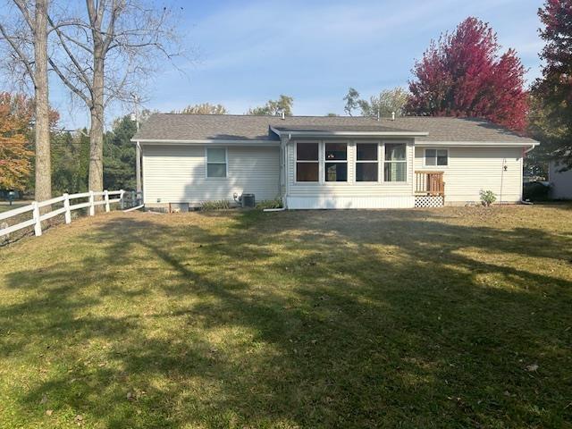 back of house featuring a yard