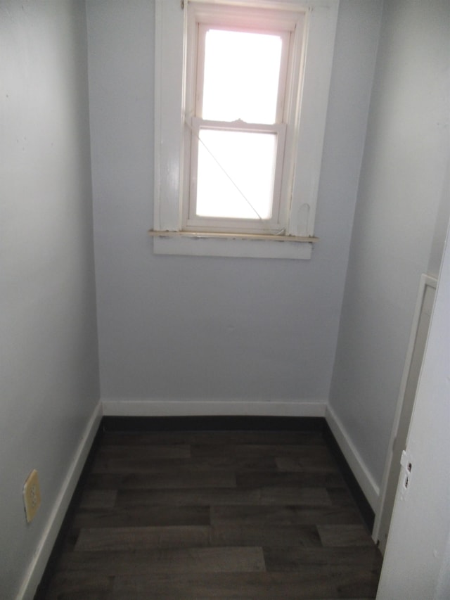 spare room with dark hardwood / wood-style floors