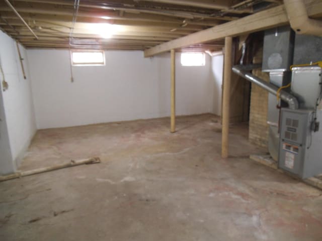 basement featuring heating unit