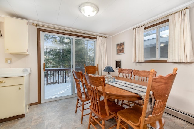 dining area with baseboard heating and ornamental molding