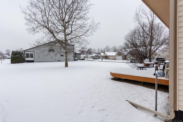 view of yard layered in snow