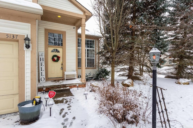 view of snow covered property entrance