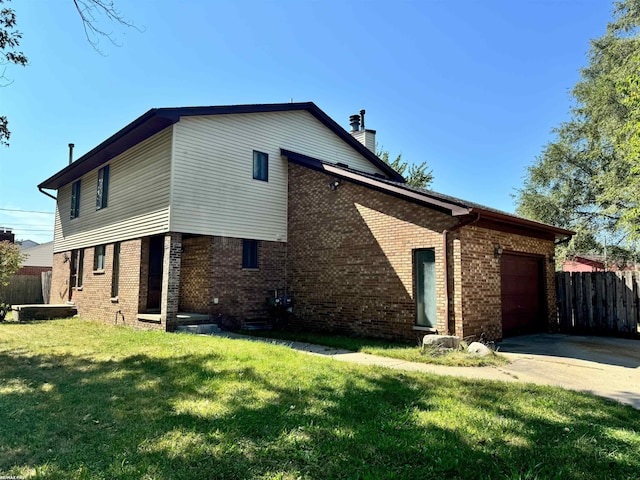 view of home's exterior with a yard and a garage