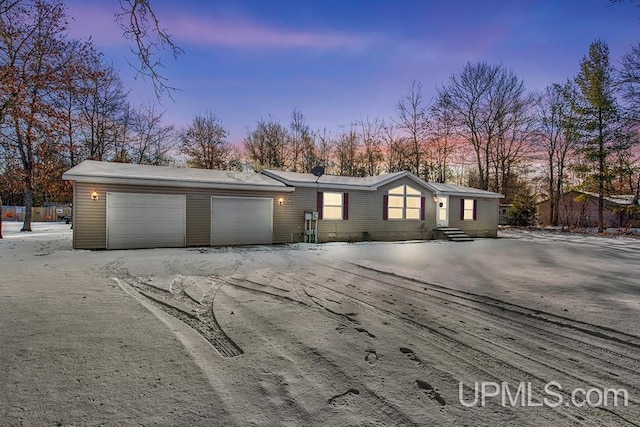 ranch-style home featuring a garage