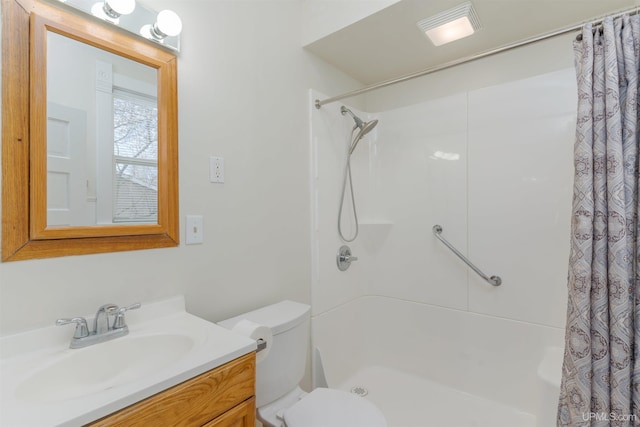 bathroom with vanity, a shower with curtain, and toilet