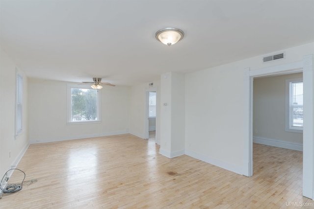 unfurnished room with ceiling fan and light hardwood / wood-style flooring