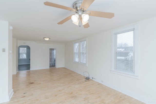 spare room featuring ceiling fan and light wood-type flooring