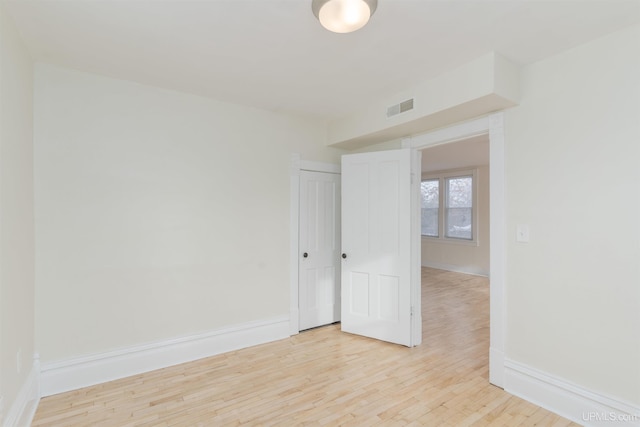 spare room featuring light wood-type flooring