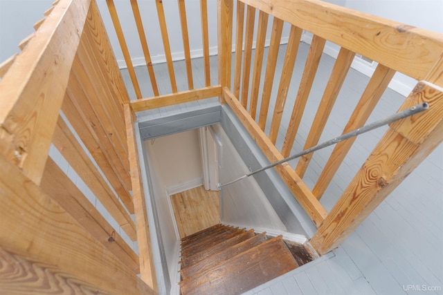 stairway with wood-type flooring