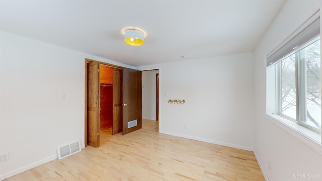 spare room featuring light wood-type flooring