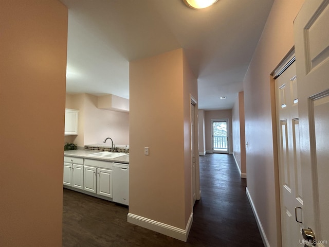 hall featuring dark hardwood / wood-style flooring and sink