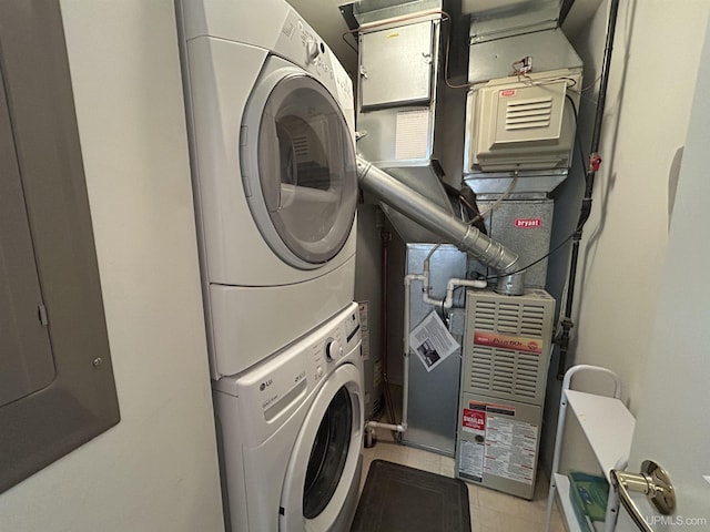 clothes washing area featuring stacked washer / drying machine