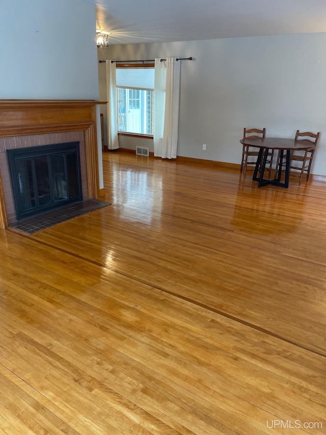 unfurnished living room featuring light hardwood / wood-style floors