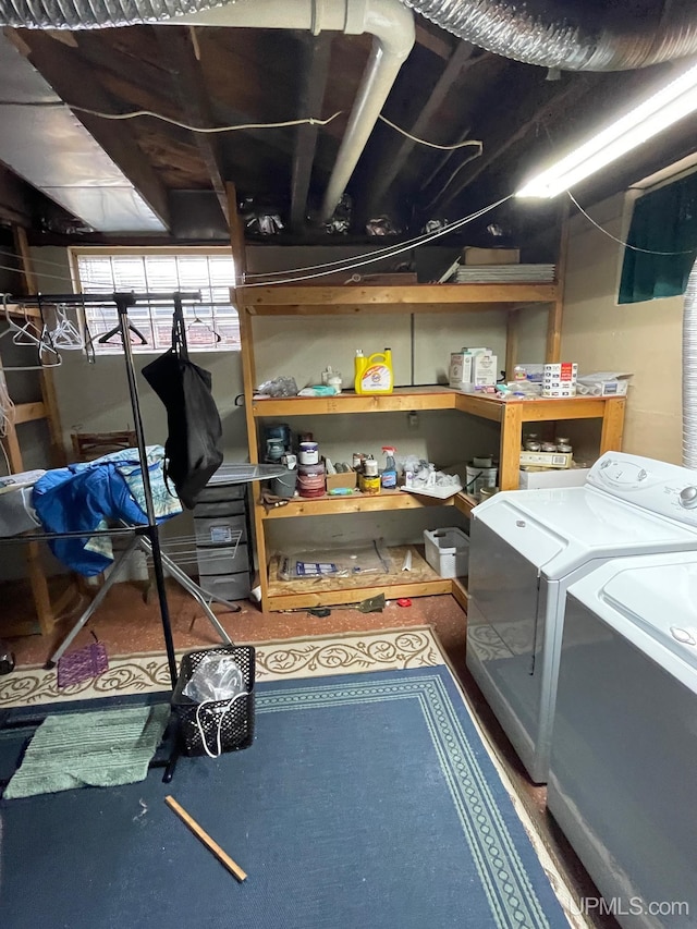 storage room with separate washer and dryer