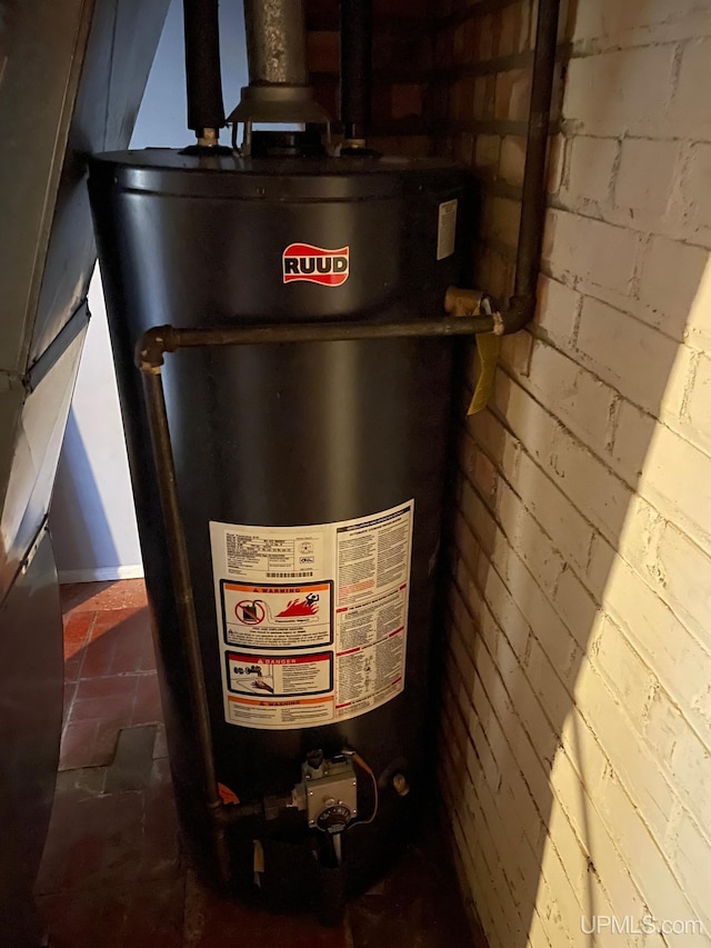 utility room with gas water heater