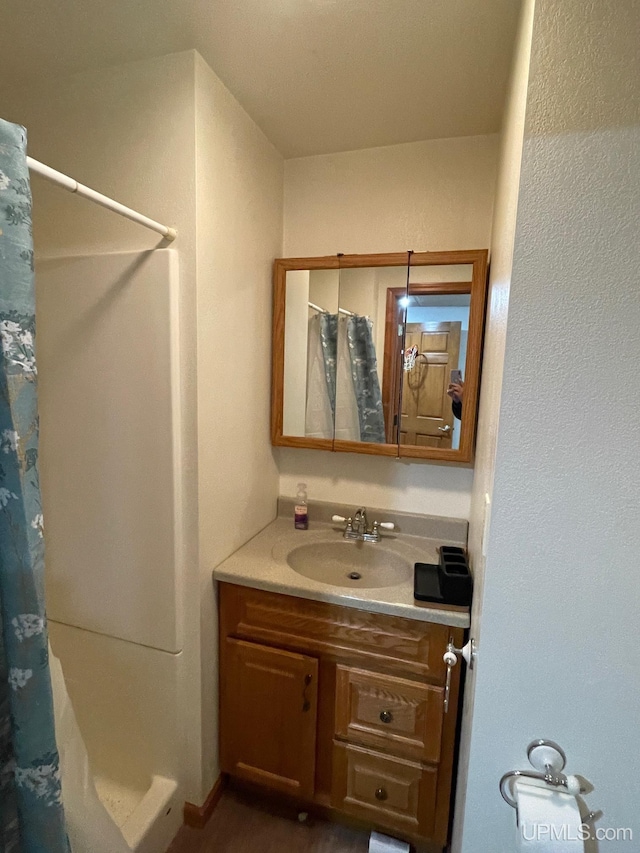 bathroom with vanity and a shower with curtain