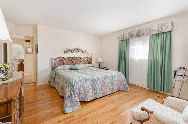 bedroom with hardwood / wood-style flooring