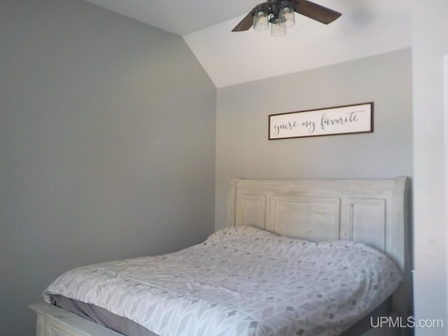 bedroom featuring vaulted ceiling and ceiling fan