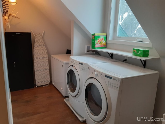 laundry area with washing machine and dryer and dark hardwood / wood-style floors