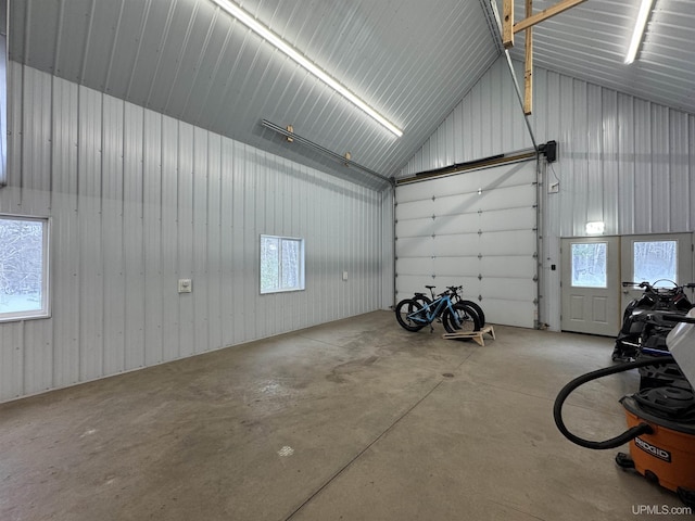 garage featuring wooden walls