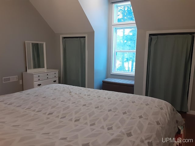 bedroom with vaulted ceiling