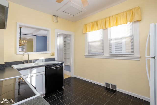 kitchen with dishwasher, white fridge, sink, and white cabinets