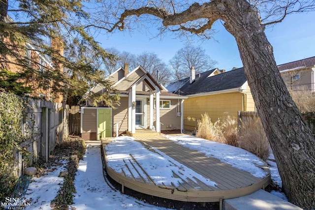 exterior space with a deck and a shed